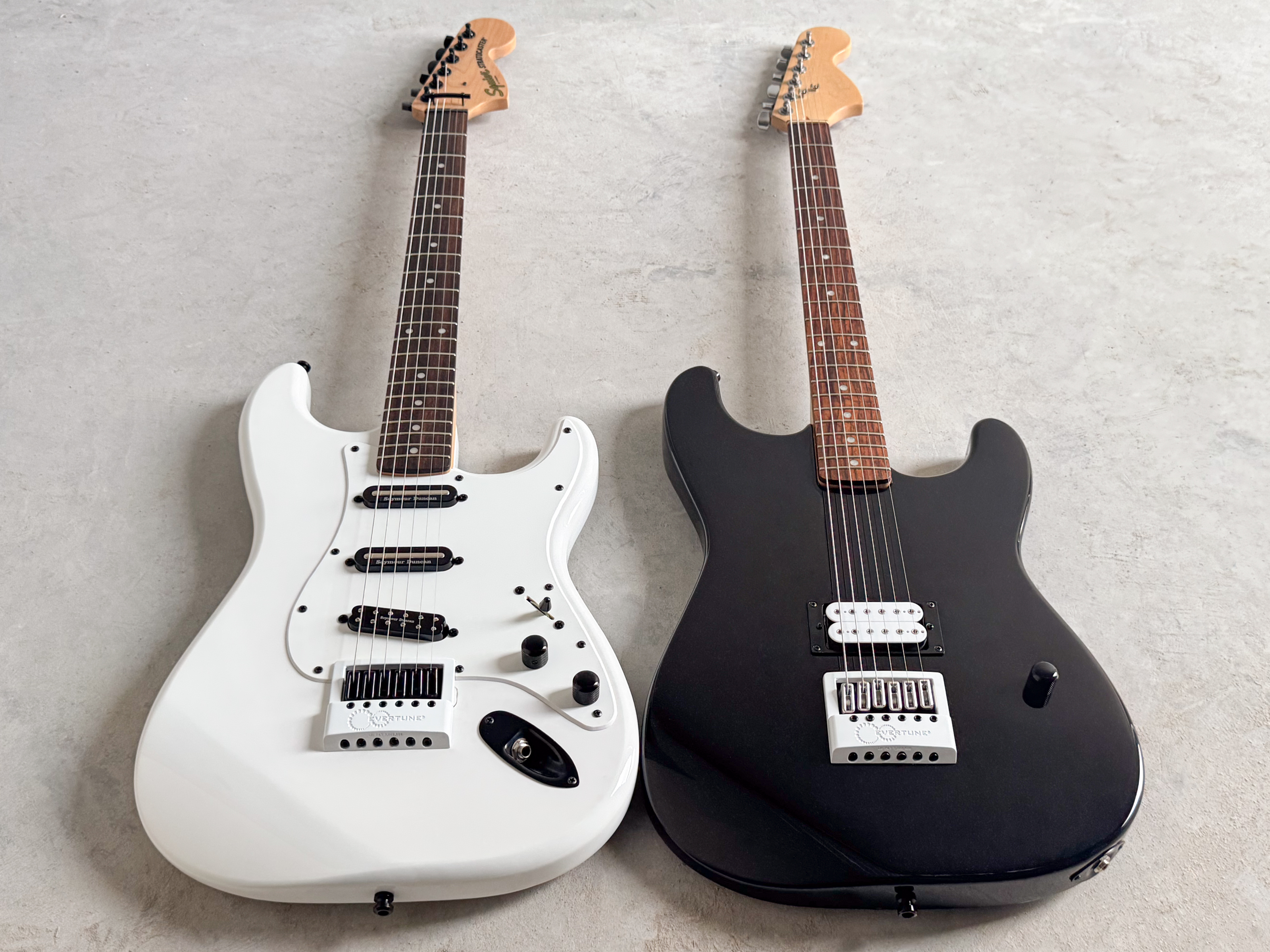 Two EverTune&reg;-equipped guitars wearing Limited-Edition Powder-Coated White Matte faceplates